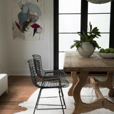 Rustic White Dining Room with Brown Dining Table and Black Metal Chairs 