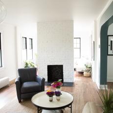 Contemporary White Sunroom with White Brick Fireplace 