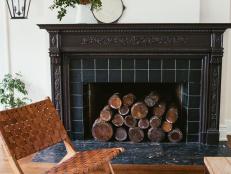 Black Fireplace and Brown Wood Chair 