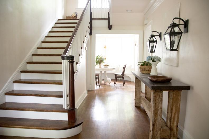 White Foyer with Brown and White Wooden Staircase