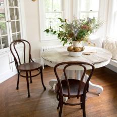 Contemporary White Breakfast Nook with Brown Hardwood Floor