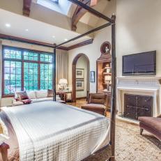 Luxurious Master Bedroom Features Stately Fireplace, Built-In Bookshelves