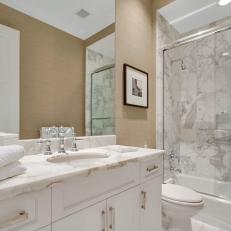 Modern Guest Bath With Marble-Topped Vanity and Backsplash