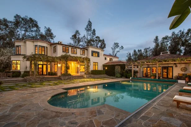 Morning sunlight on a Mediterranean-style villa pool area
