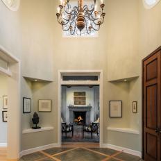 Dramatic Two-Story Foyer Features Elegant Chandelier