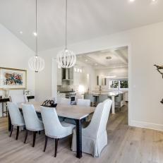 White, Transitional Dining Room with Modern Lighting