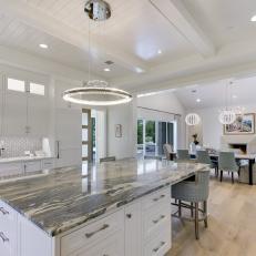 White, Open-Concept Kitchen with Large Center Island