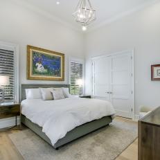 White Bedroom with Vivid Artwork