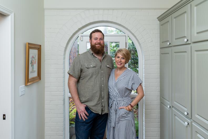As seen on Home Town, Ben and Erin Napier (C) have completely renovated this Laurel, Mississippi home for Grant and Emily Saxton.  The side entry on the house into the mud room originally featured a beautiful brick arch but the existing room was dull and full of doors and cabinets.  The renovated entry and mudroom now features a beautiful wall of functional cabinetry as well as a new laundry room area. (portrait)