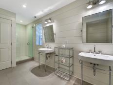 modern master bathroom with pedestal sinks