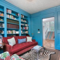 Bright Blue Library Pairs Tufted Sofa, Zebra-Print Rug