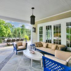 Covered Patio Enlivened By Electric Blue Outdoor Furniture