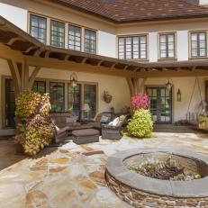 French Country Mansion With Stone Fire Pit