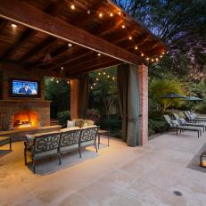 Cabana Shines With Bistro Lights, Stone Fireplace 