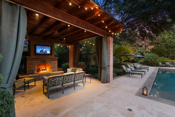 Cabana Shines With Bistro Lights, Stone Fireplace | HGTV