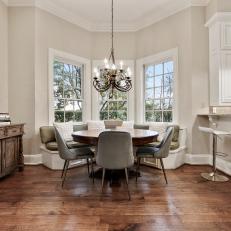 Transitional Breakfast Nook With Curved, Built-In Banquette and Round Table