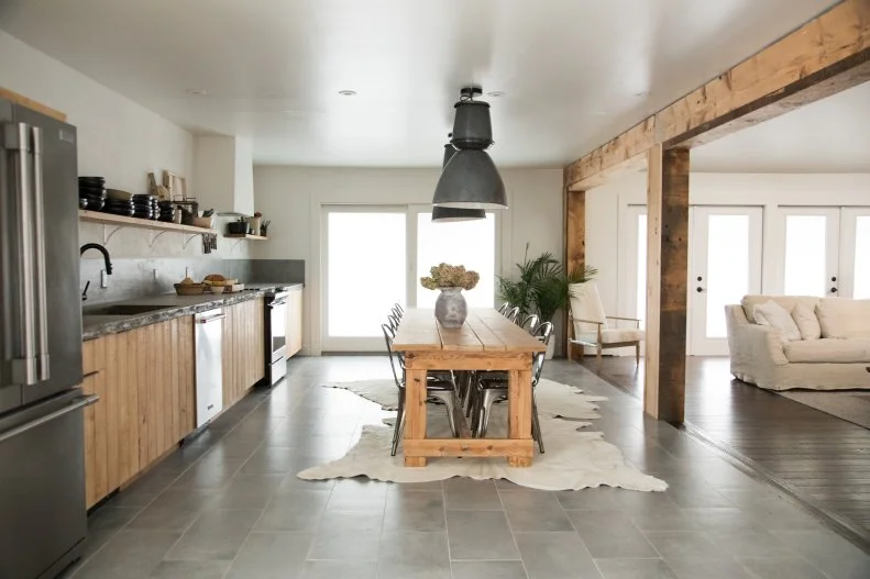 The new open concept giant kitchen with wood panneling to create a modern ski lodge that Steve and Leanne Ford designed for Steve's long time friend Jan and her family as seen on Restored by the Fords                                                                Kitchen after 3