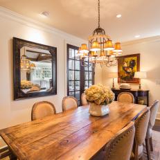Intimate, Cozy Dining Room Features Rustic Wood Table, French Dining Chairs