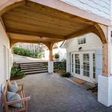 Porte-Cochere Offers Covered Access to Side Entrance of French Country-Style Home