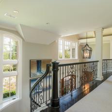 Staircase Landing with Scroll Iron Railing