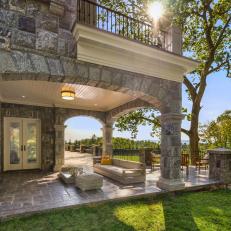 Mansion with Stone Facade and Sleek Outdoor Patio