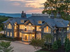 Aerial View of Stone Exterior Mansion at Sunset