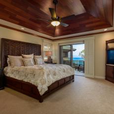 Neutral Tropical Bedroom With Wood Ceiling