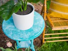 Salt Painted Outdoor Side Table Topped With a Potted Plant