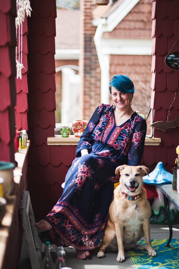 Susan Harlan and dog Millie on a Red Shingled Porch
