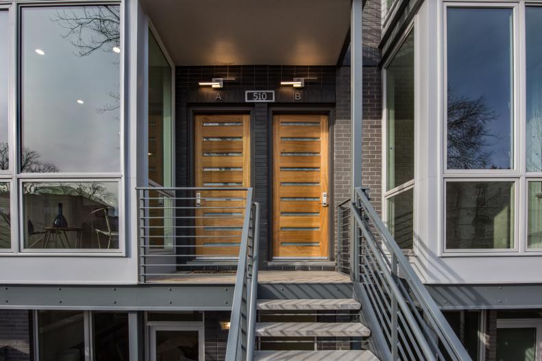 modern condo with wooden front door