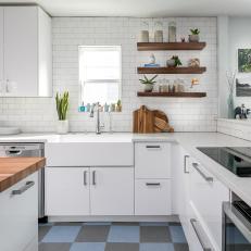 White Open Plan Kitchen With Cutting Boards