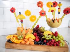 Follow our simple fruit carving tips to make the sweetest arrangement for any summer get-together.