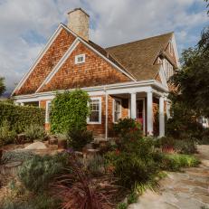 Two-Story Shingled Home Features Gardens on Either Side