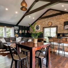 Rustic Great Room With Stone Wall