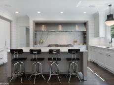 Four-top Marble Kitchen Island and Wide Steel Range Hood 