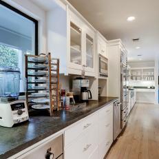 Galley-Style Kitchen With White Cabinets