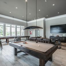 Gray Transitional Game Room with Custom Lighting