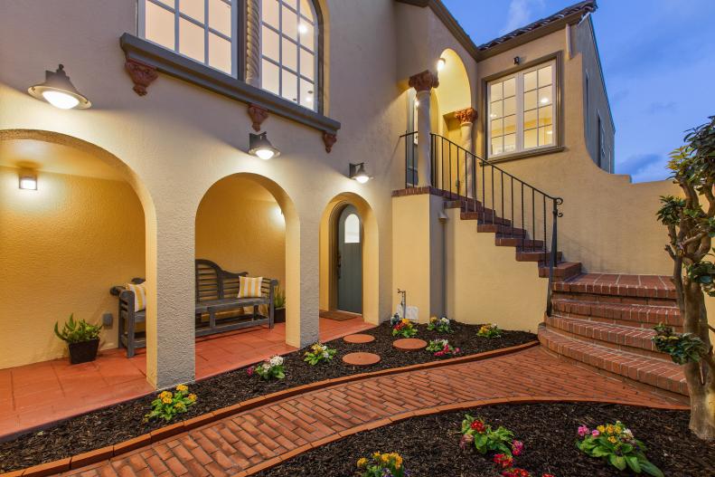 Yellow Stucco Home With Long Stair-step Entryway 