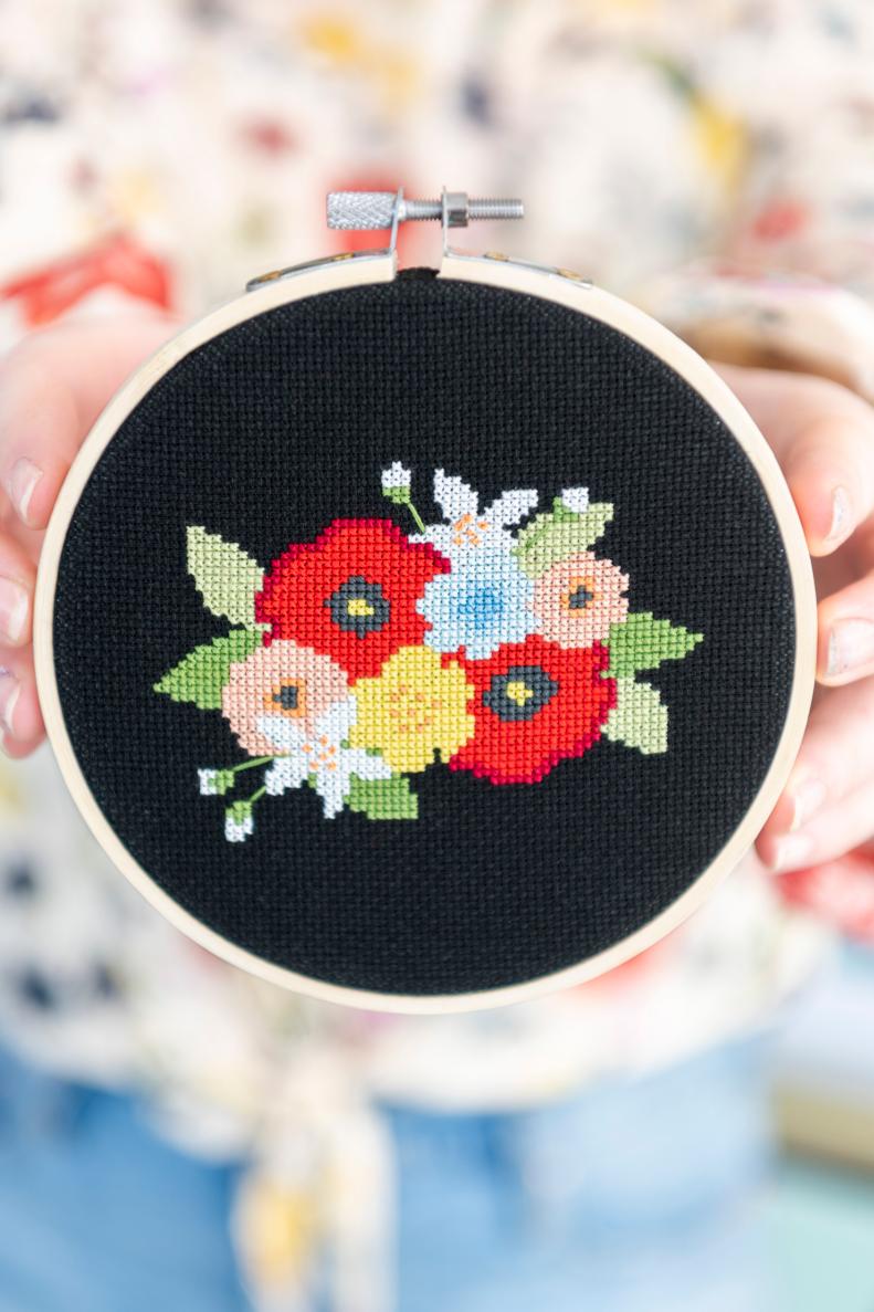 Gorgeous Cross-Stitched Flowers on a Black Fabric Background