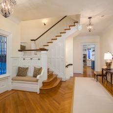 Timeless Foyer With Traditional Staircase, Built-In Banquette