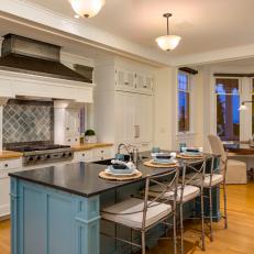 Teal Island Meets Silver Barstools in Transitional Eat-In Kitchen