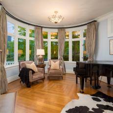 Traditional Parlor Includes Fireplace and Grand Piano 