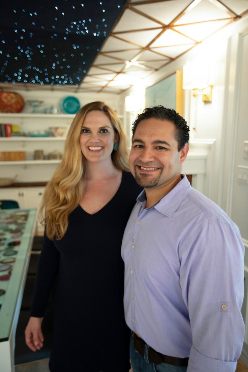 Portrait of Amy and Isaac Flores during reveal with the star ceiling.