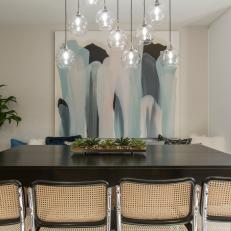 Contemporary White Dining Room with Black Dining Table 