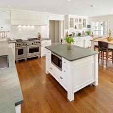 Black Countertops, Island Create Striking Contrast in Transitional Kitchen