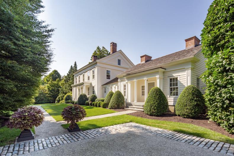 Greek Revival home with formal gardens