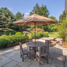 Traditional Flagstone Patio Equipped With Outdoor Dining Set 