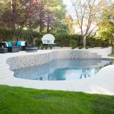 Neutral Modern Backyard with Black Sofa and Swimming Pool 