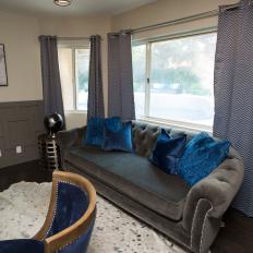 Modern Gray Den with Gray Sofa and Blue Pillows 