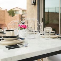 Contemporary Neutral Outdoor Dining Area  with Black and White Dining Table 